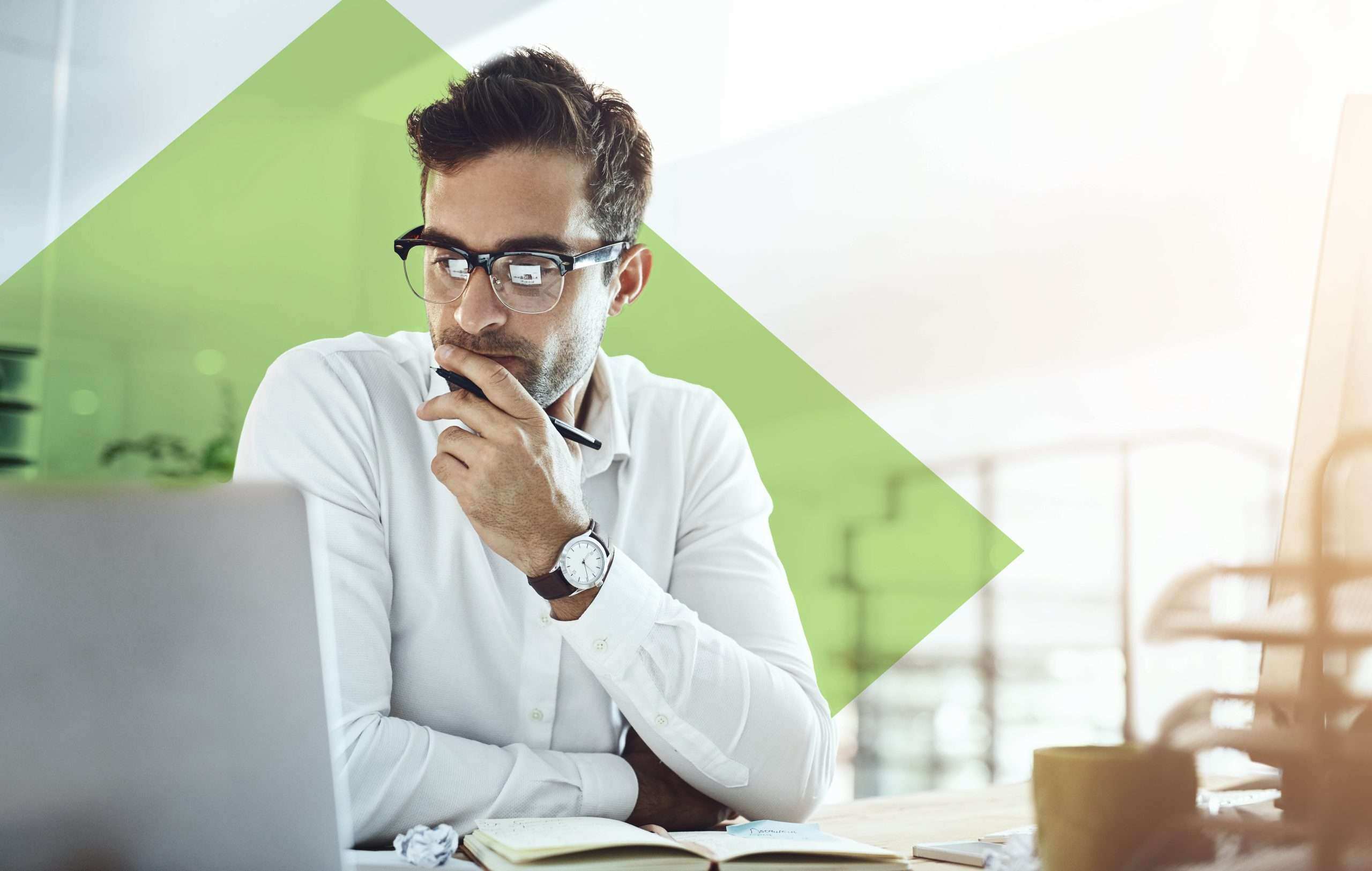 Man pondering at laptop