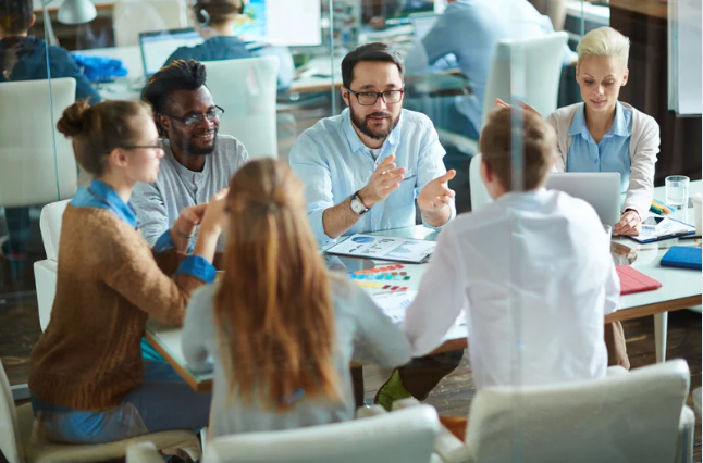 people talking at office table